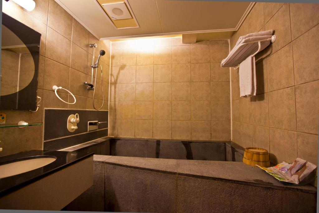 Koupelna v ubytování Tian Long Hotel