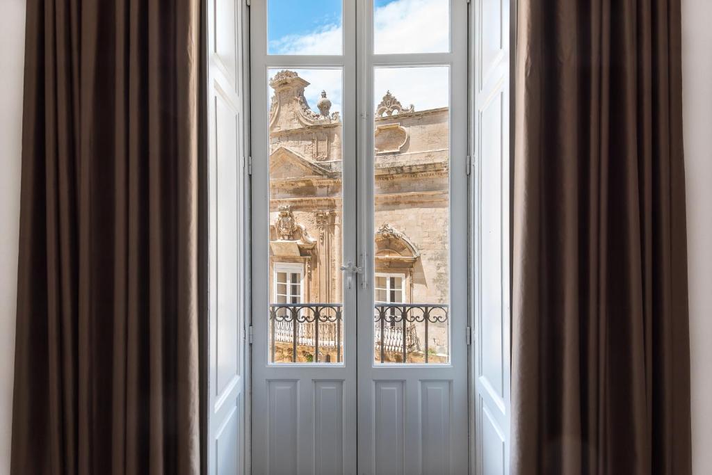 Balkón nebo terasa v ubytování D-Home Ortigia