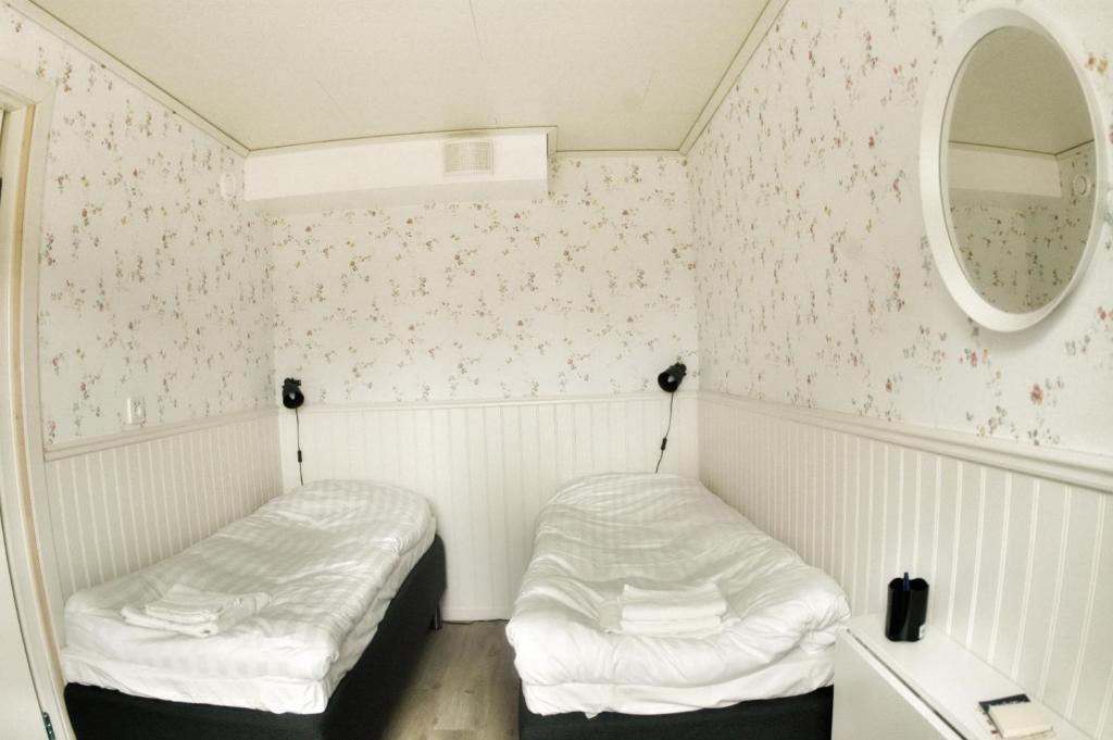Postel nebo postele na pokoji v ubytování Lundsbrunn B&B