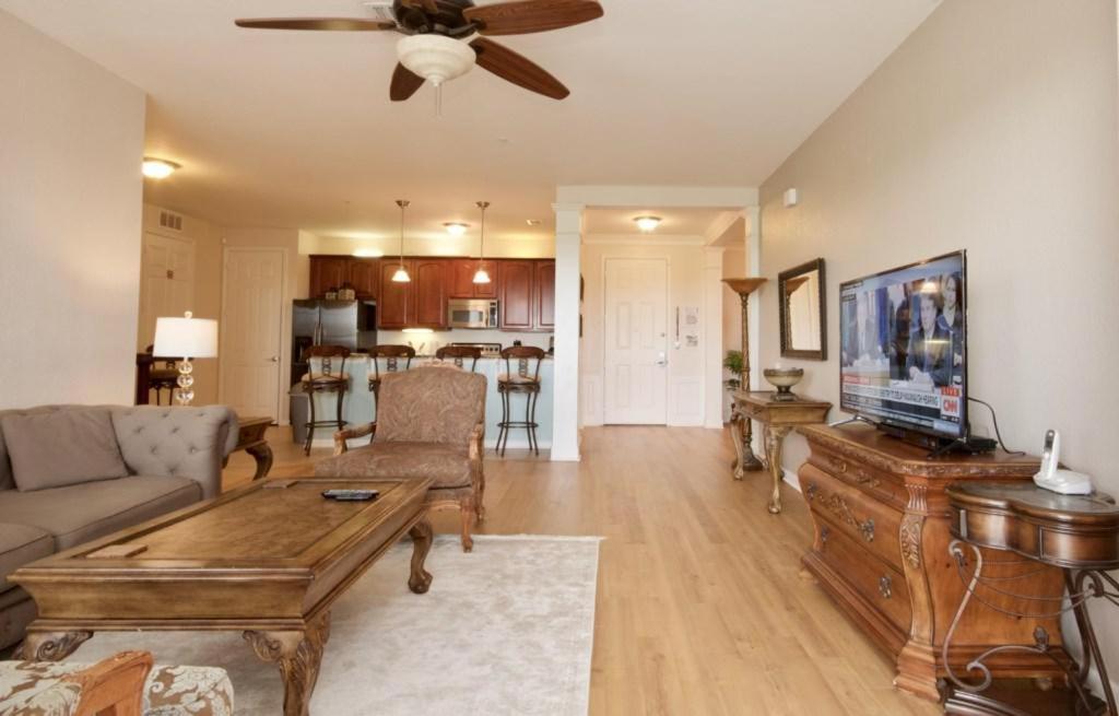 a living room with a couch and a table at Shoreway Condo #231522 in Orlando