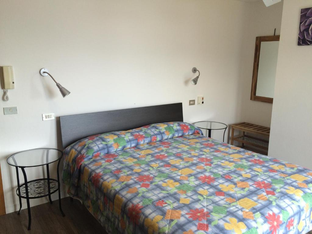 Postel nebo postele na pokoji v ubytování Hotel Casa Popi