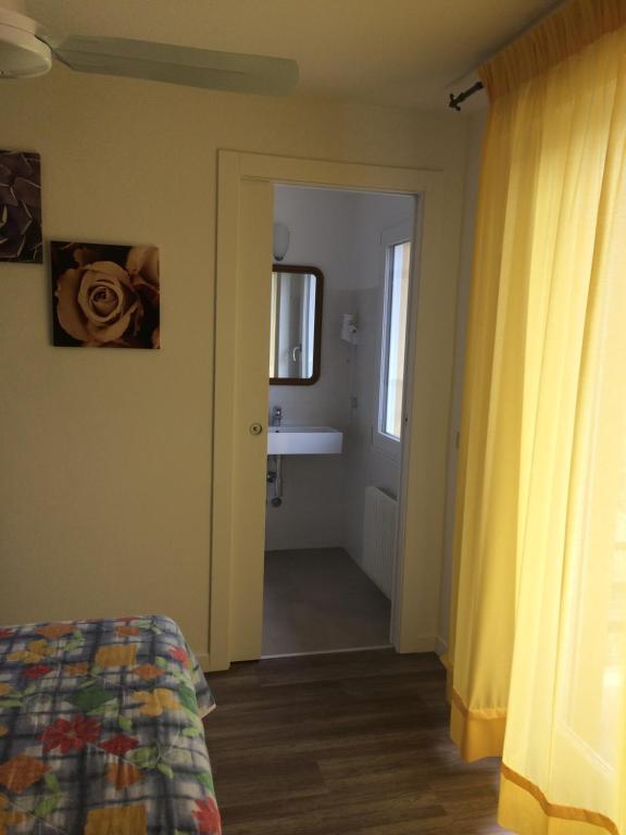 Postel nebo postele na pokoji v ubytování Hotel Casa Popi