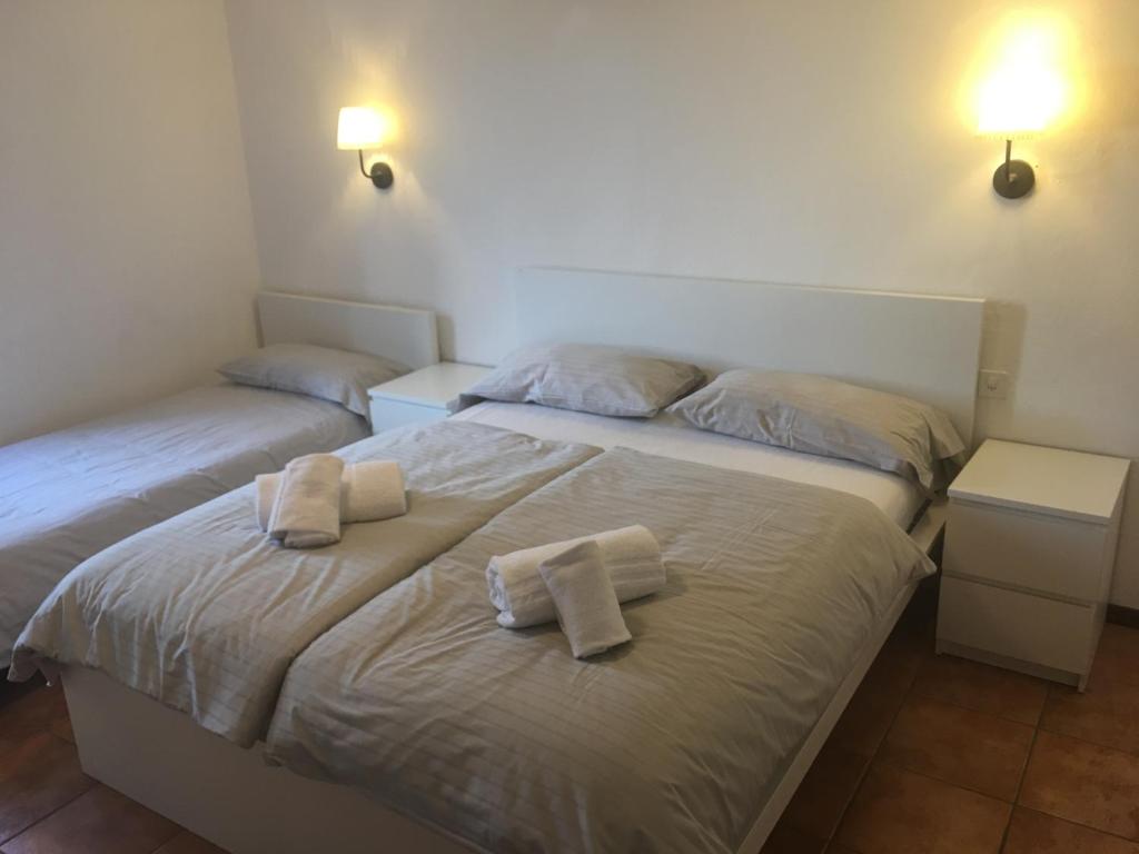 Postel nebo postele na pokoji v ubytování Albergo Ristorante Belcantone