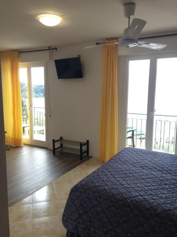 Postel nebo postele na pokoji v ubytování Hotel Casa Popi