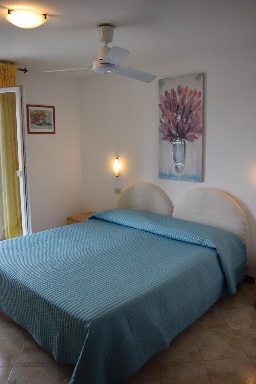 Postel nebo postele na pokoji v ubytování Hotel Casa Popi