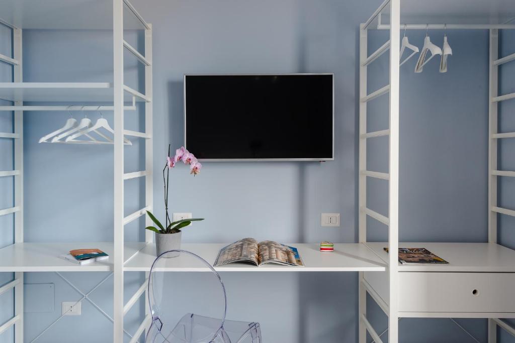 TV a/nebo společenská místnost v ubytování D-Home Ortigia