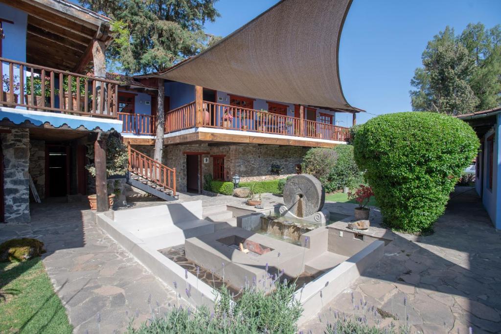 Un jardín fuera de La Casa Azul Huasca & Restaurante La Terraza