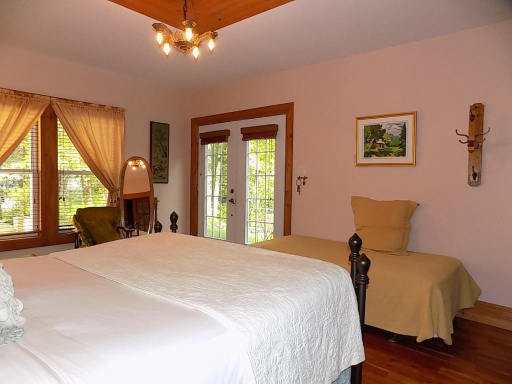 Postel nebo postele na pokoji v ubytování À L'Ancestrale B&B