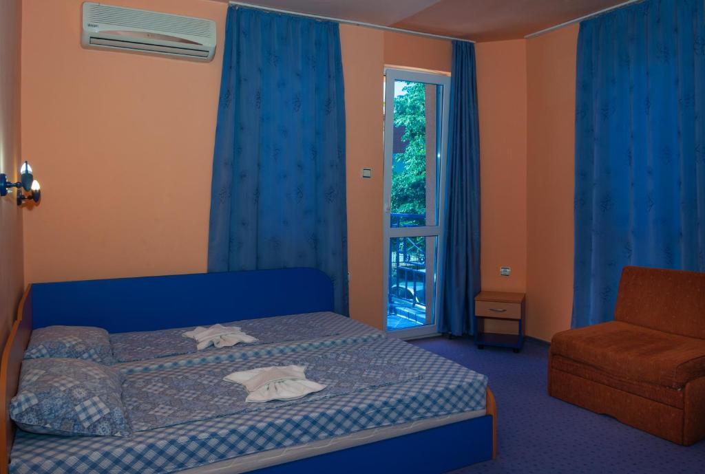 Postel nebo postele na pokoji v ubytování Dara Hotel