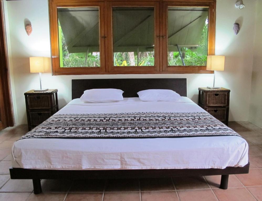 Postel nebo postele na pokoji v ubytování Beachouse Resort
