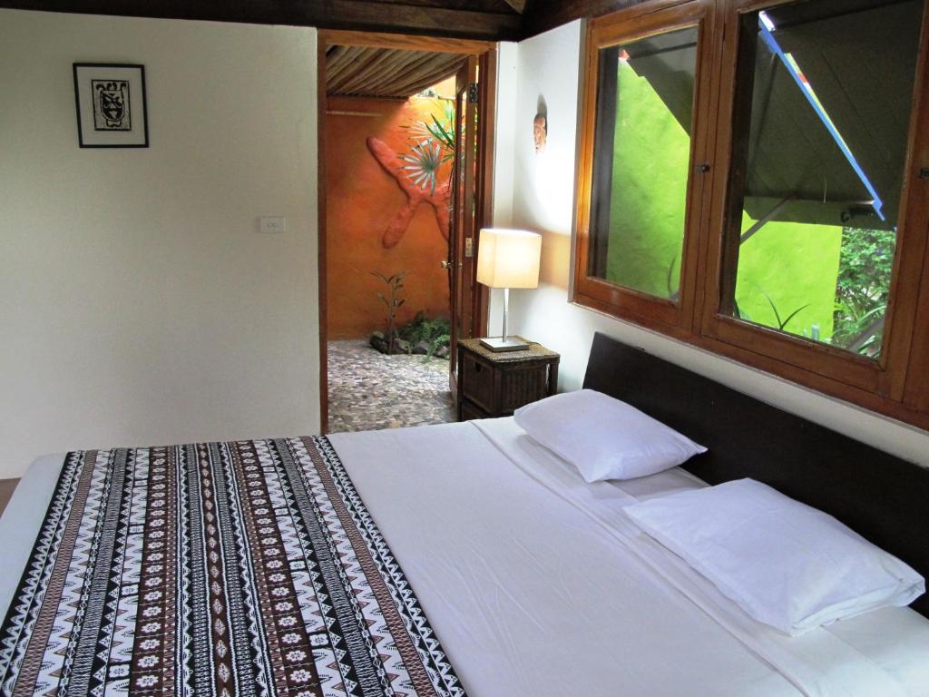 Postel nebo postele na pokoji v ubytování Beachouse Resort