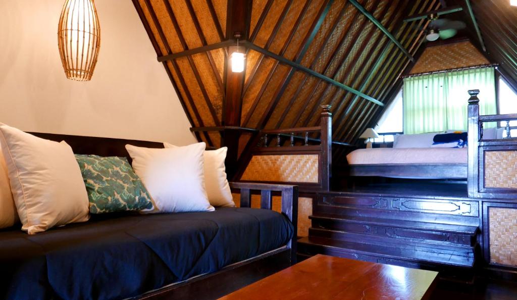 Postel nebo postele na pokoji v ubytování Istana Balian - Boutique Hotel Resort