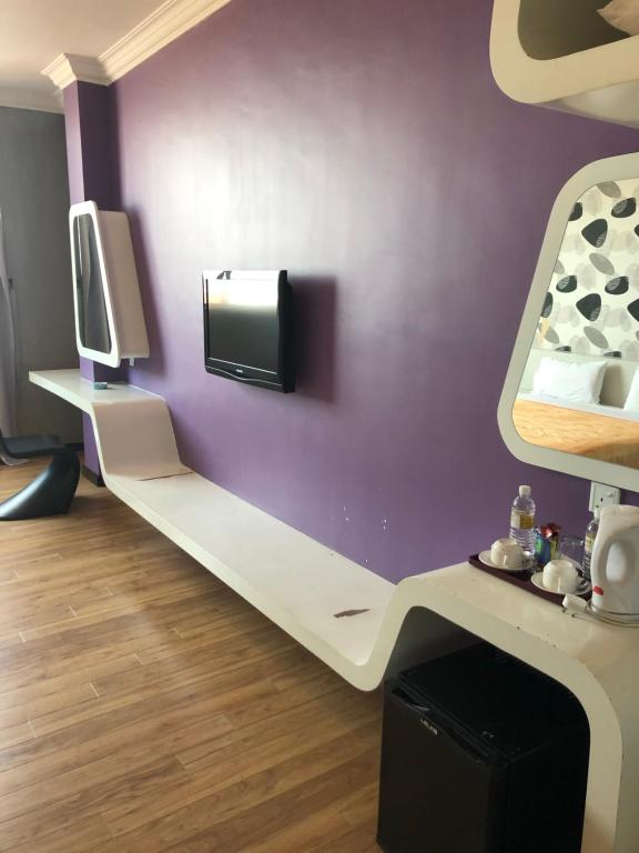 TV a/nebo společenská místnost v ubytování King Park Hotel Tawau