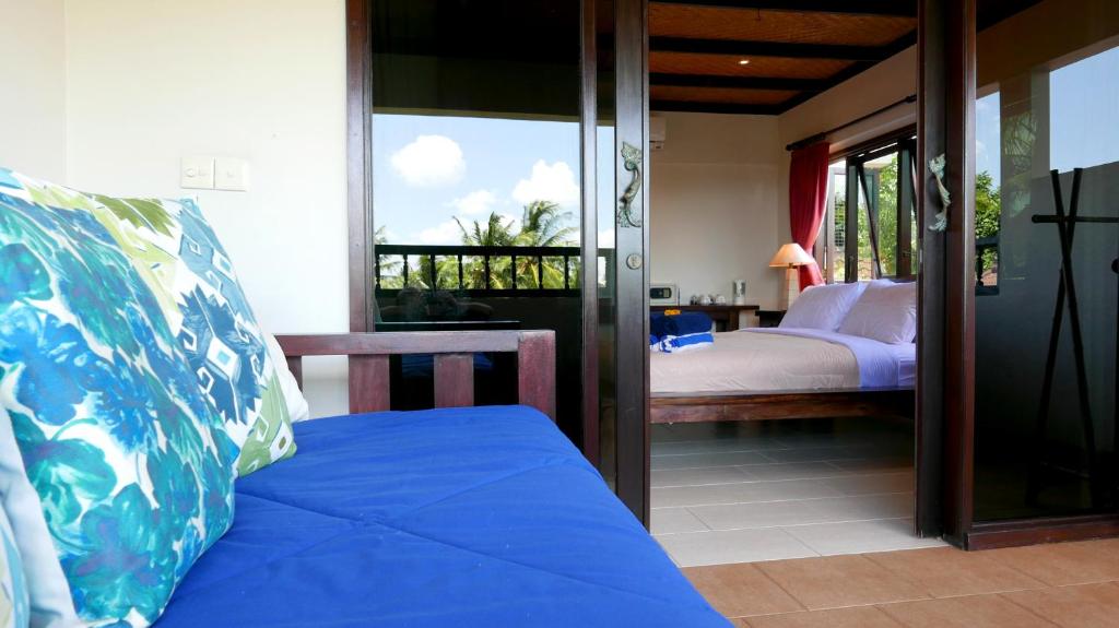 Postel nebo postele na pokoji v ubytování Istana Balian - Boutique Hotel Resort