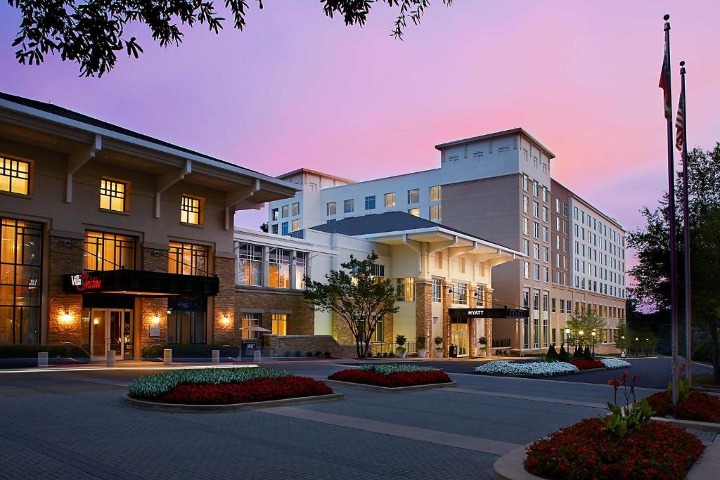 a building with a lot of windows and a street at Hyatt Regency Atlanta Perimeter at Villa Christina in Atlanta
