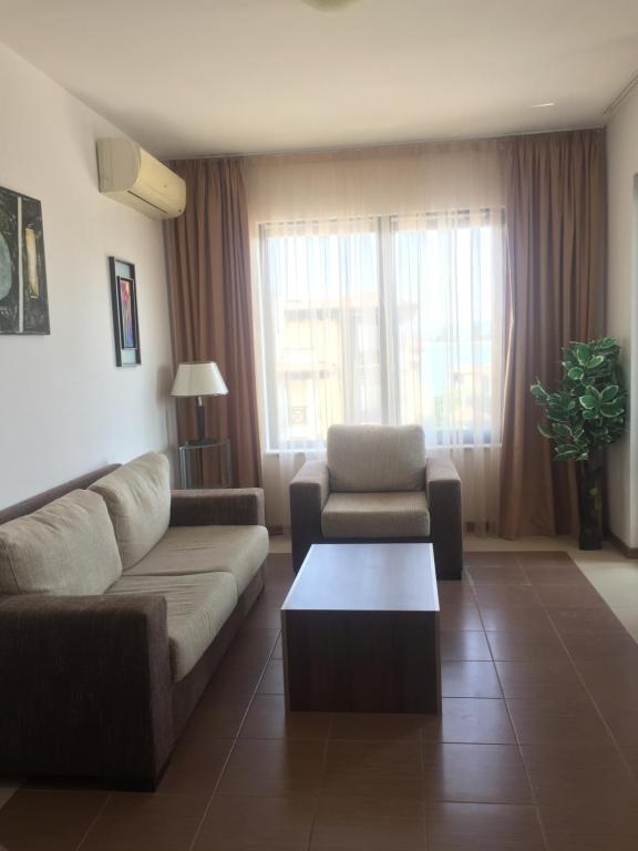 A seating area at Apartment on the sea at St Nikolas Complex-Elena