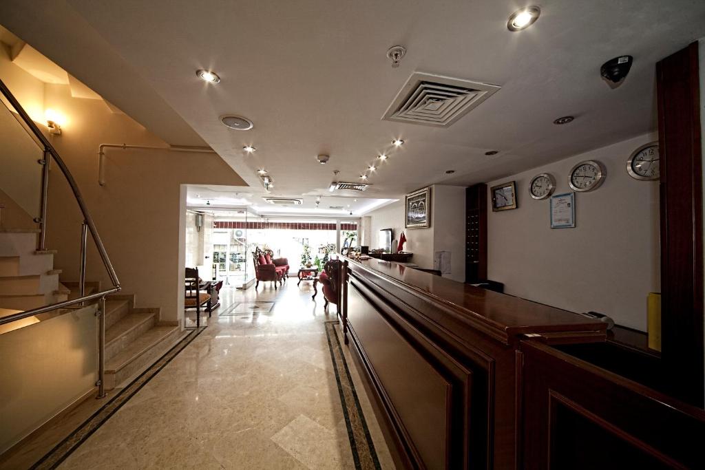 a long hallway with a bar in a restaurant at Istanbul Newcity Hotel in Istanbul