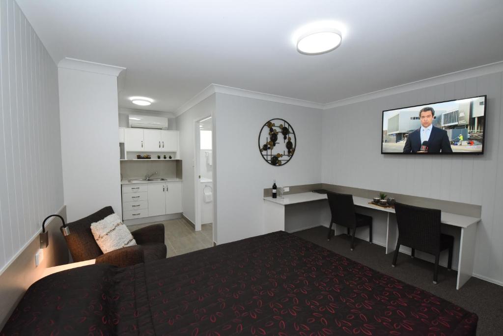 Kuchyň nebo kuchyňský kout v ubytování Raintree Motel Biloela