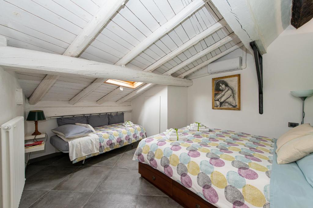 Postel nebo postele na pokoji v ubytování B&B Il Tetto di Anita