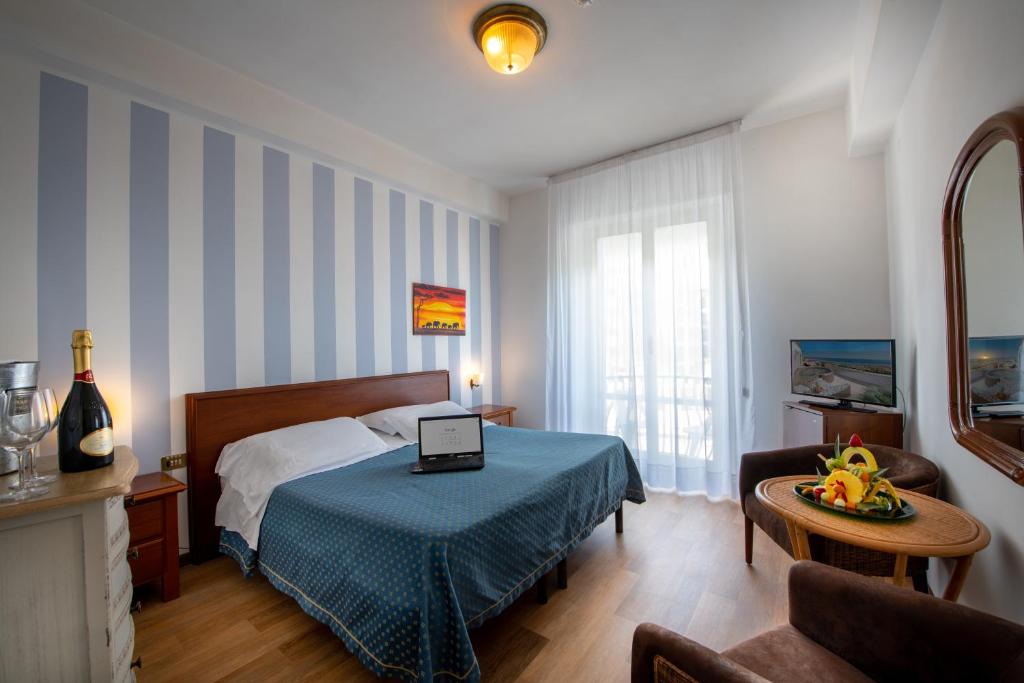 Łóżko lub łóżka w pokoju w obiekcie Grand Hotel Excelsior