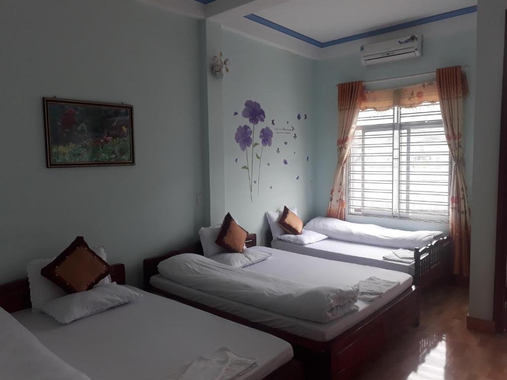 Postel nebo postele na pokoji v ubytování Binh Minh Hostel
