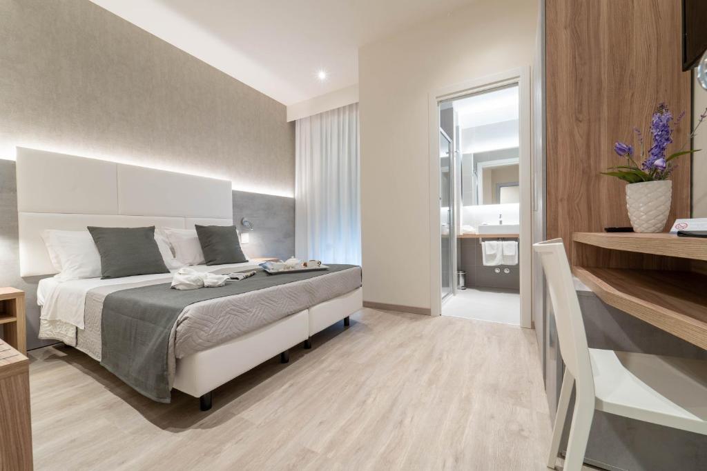 Postel nebo postele na pokoji v ubytování Hotel Reggiana