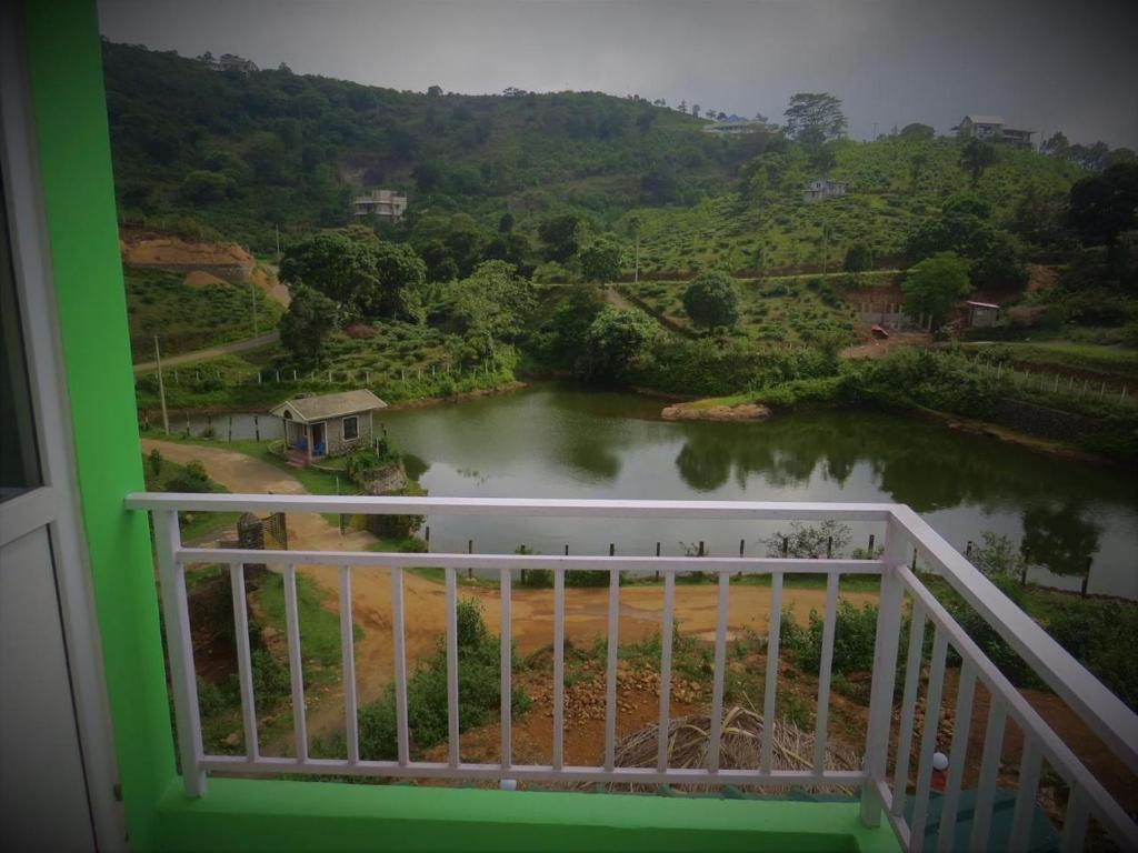 a view of a river from a balcony at Honeybee residency Vagamon in Vagamon