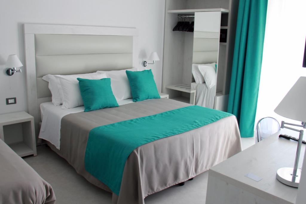 Postel nebo postele na pokoji v ubytování Park Hotel Giusy
