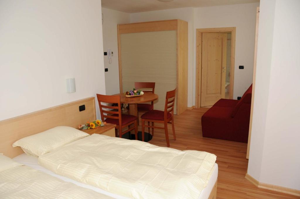 Łóżko lub łóżka w pokoju w obiekcie Agritur alla Veduta