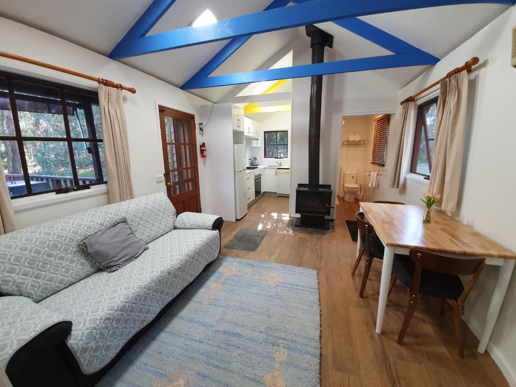 a living room with a couch and a table at Seaside Retreat in Mitchells Island