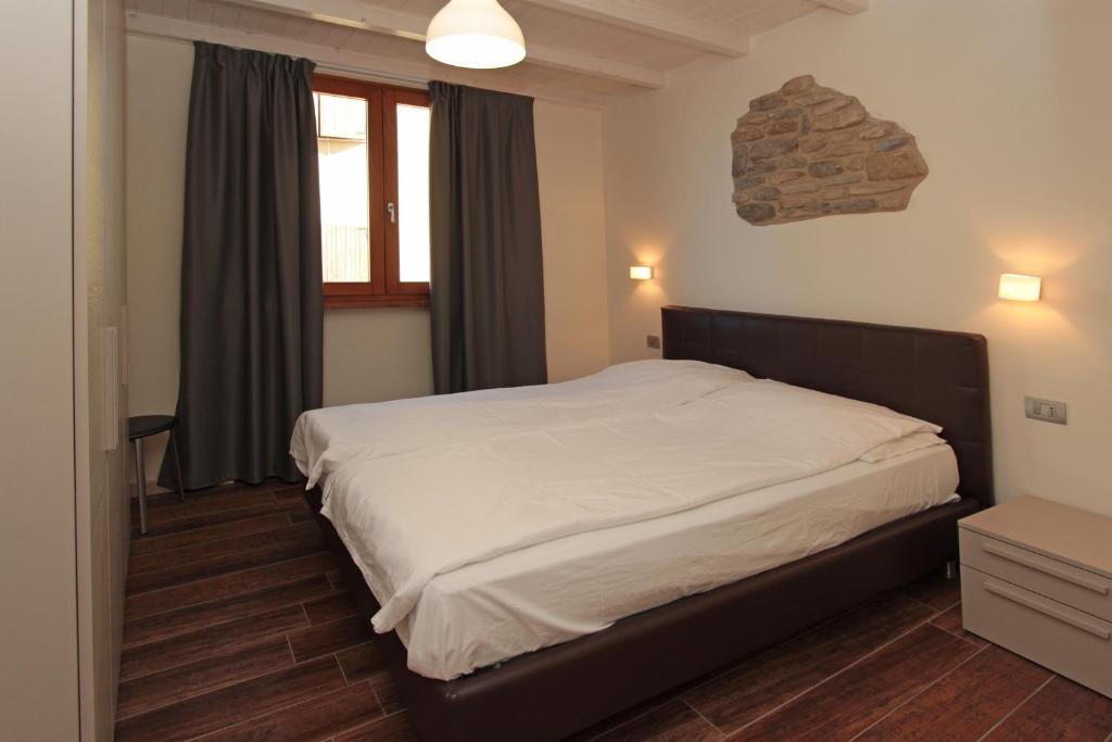 Postel nebo postele na pokoji v ubytování Al Terrazzo Apartments - Ruculì Hospitality