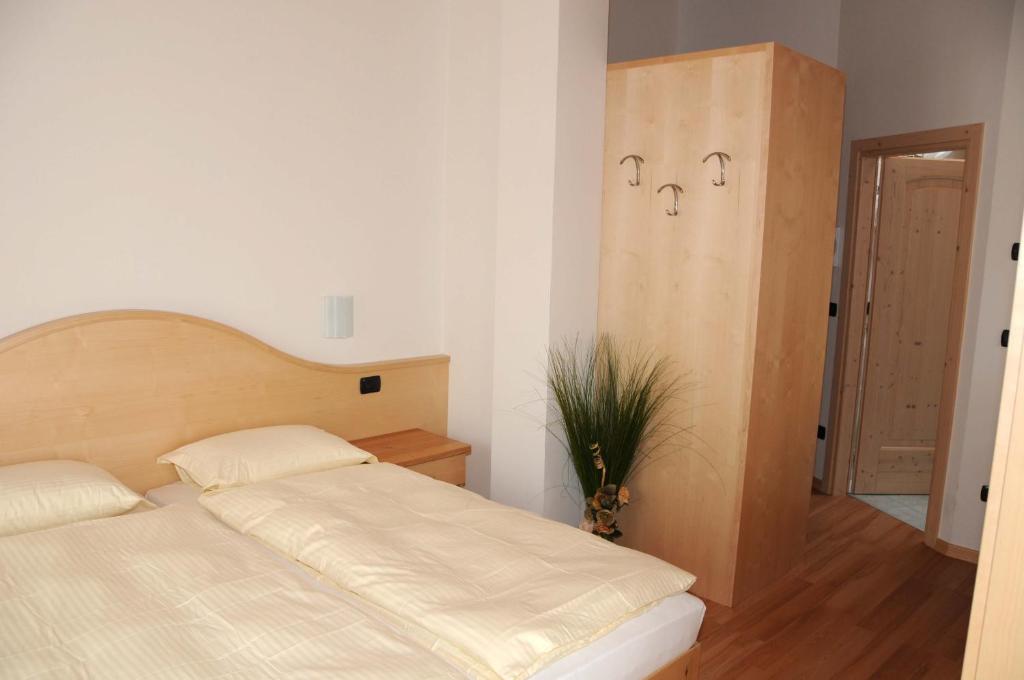 Łóżko lub łóżka w pokoju w obiekcie Agritur alla Veduta