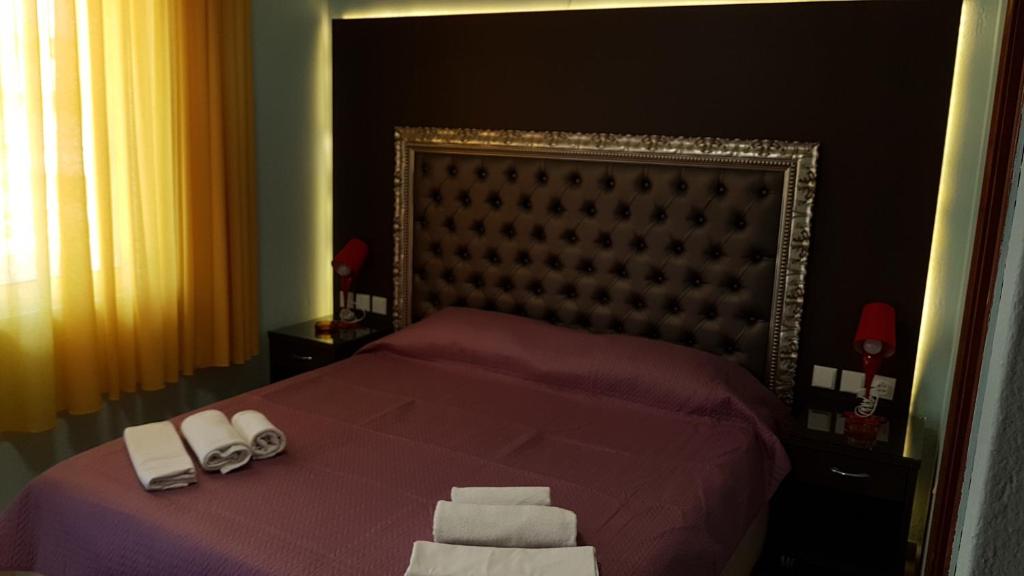 Postel nebo postele na pokoji v ubytování Hotel White Rose Beach