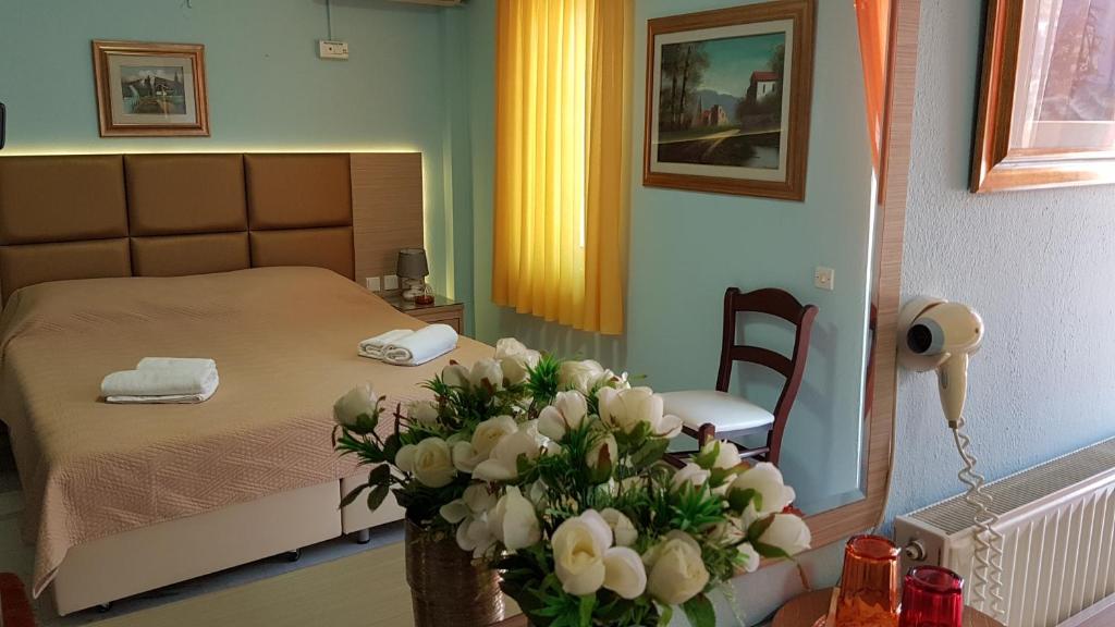Postel nebo postele na pokoji v ubytování Hotel White Rose Beach