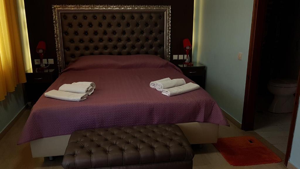 Postel nebo postele na pokoji v ubytování Hotel White Rose Beach