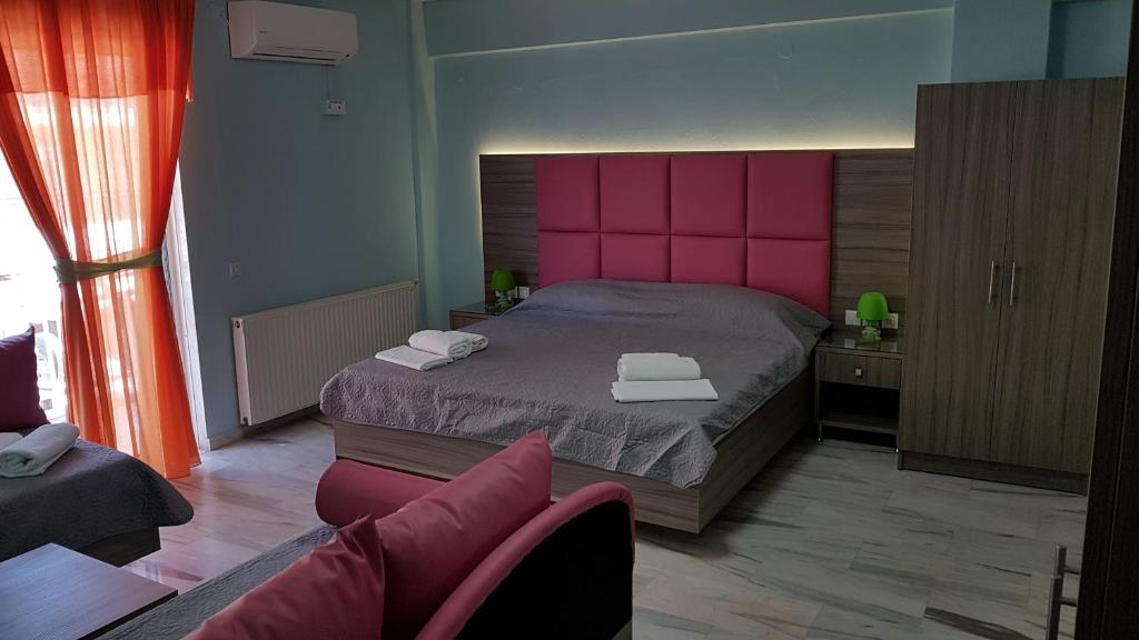 Postel nebo postele na pokoji v ubytování Hotel White Rose Beach