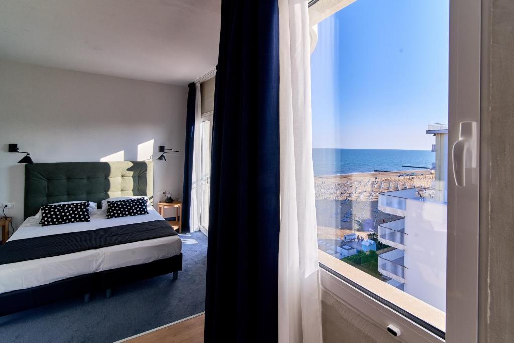 Postel nebo postele na pokoji v ubytování Hotel Concordia