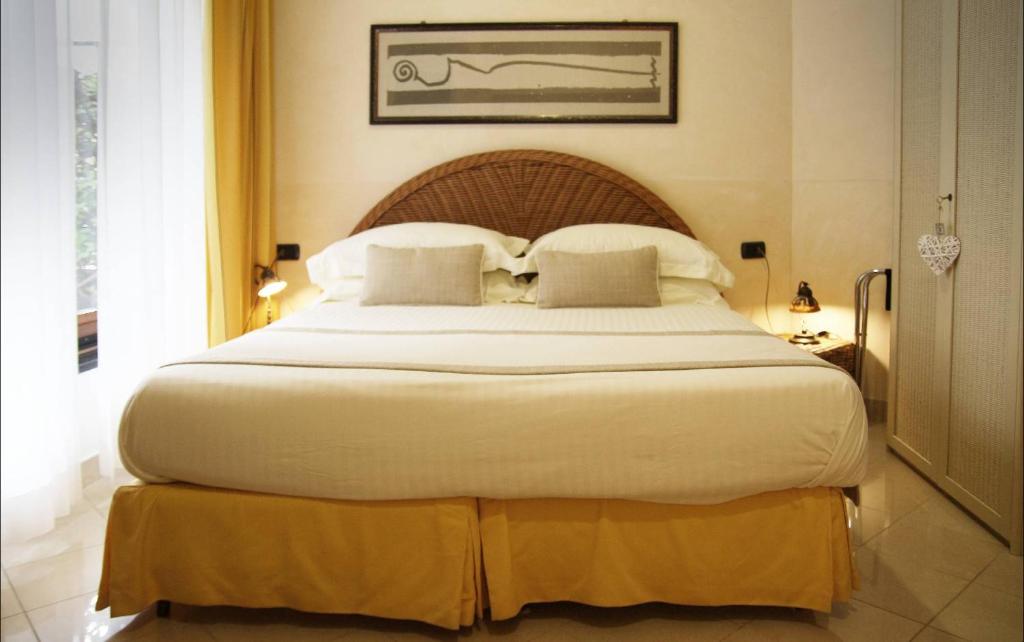 Cama ou camas em um quarto em Locanda A Cà Du Gigante