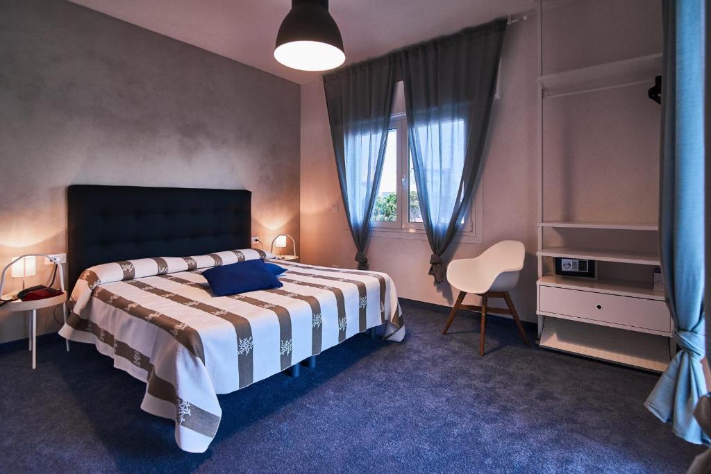 Postel nebo postele na pokoji v ubytování Hotel Concordia