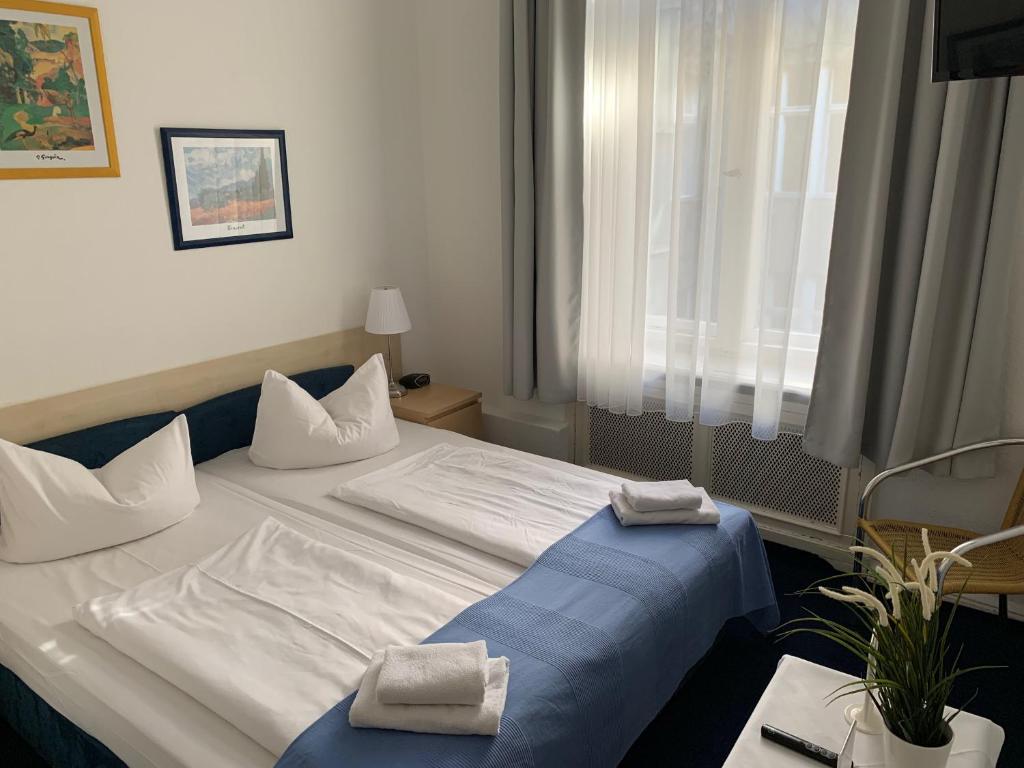 Postel nebo postele na pokoji v ubytování Hotel Seifert Berlin am Kurfürstendamm