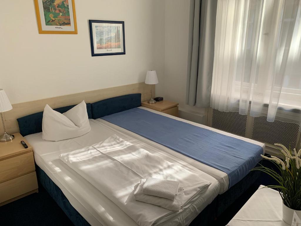 Postel nebo postele na pokoji v ubytování Hotel Seifert Berlin am Kurfürstendamm