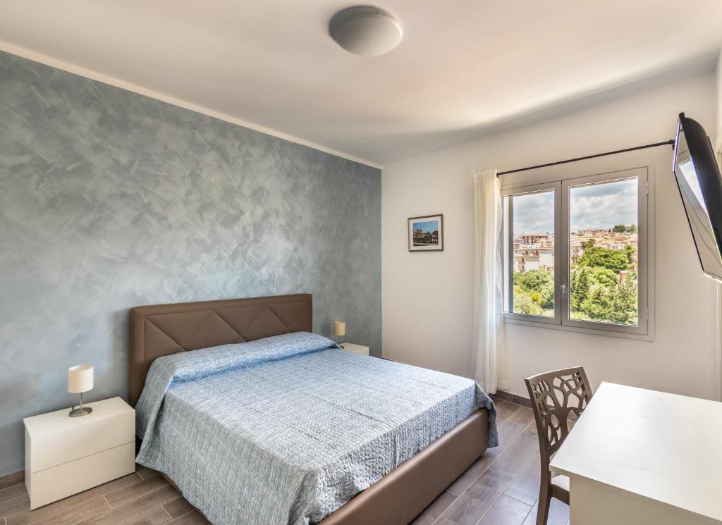 Postel nebo postele na pokoji v ubytování L'Antico Borgo B&B