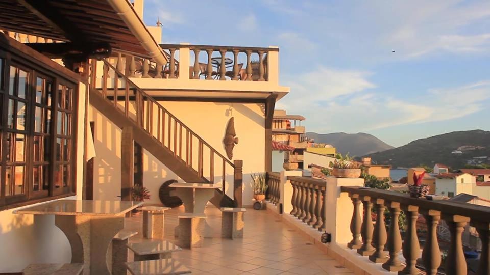 a balcony of a house with a view at Pousada Mar Dos Anjos in Arraial do Cabo