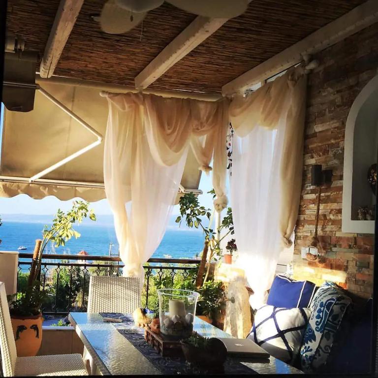 a living room with a view of the ocean at Ammos Lux Apartments in Agia Triada