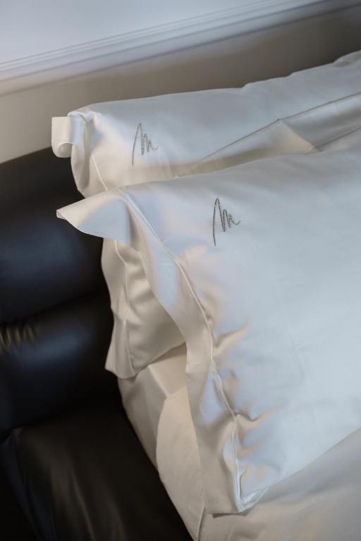 Postel nebo postele na pokoji v ubytování Relais Metelli
