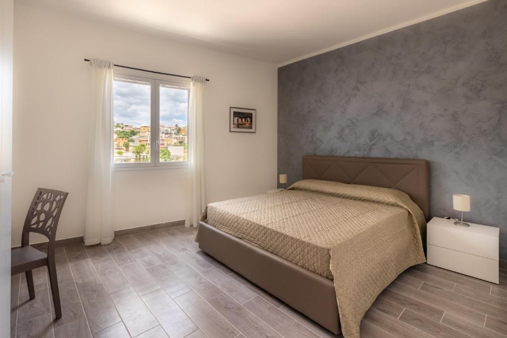 Postel nebo postele na pokoji v ubytování L'Antico Borgo B&B
