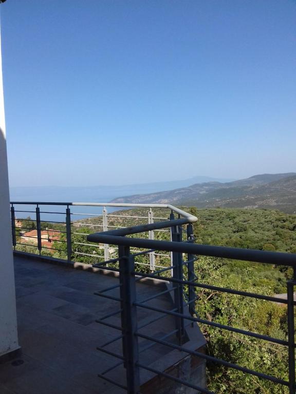 a view of the ocean from the balcony of a house at Dimitris home in Exochori