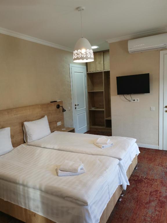 Postel nebo postele na pokoji v ubytování Boutique Hotel BelleVue
