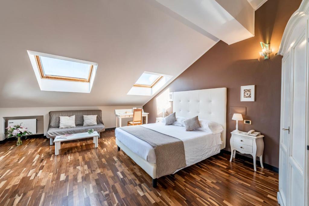 Postel nebo postele na pokoji v ubytování Hotel Asnigo