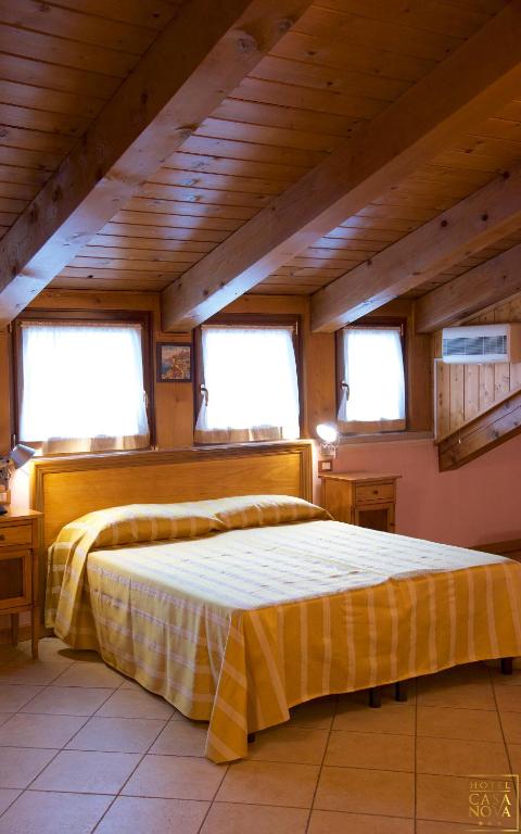 Postel nebo postele na pokoji v ubytování Hotel Casanova